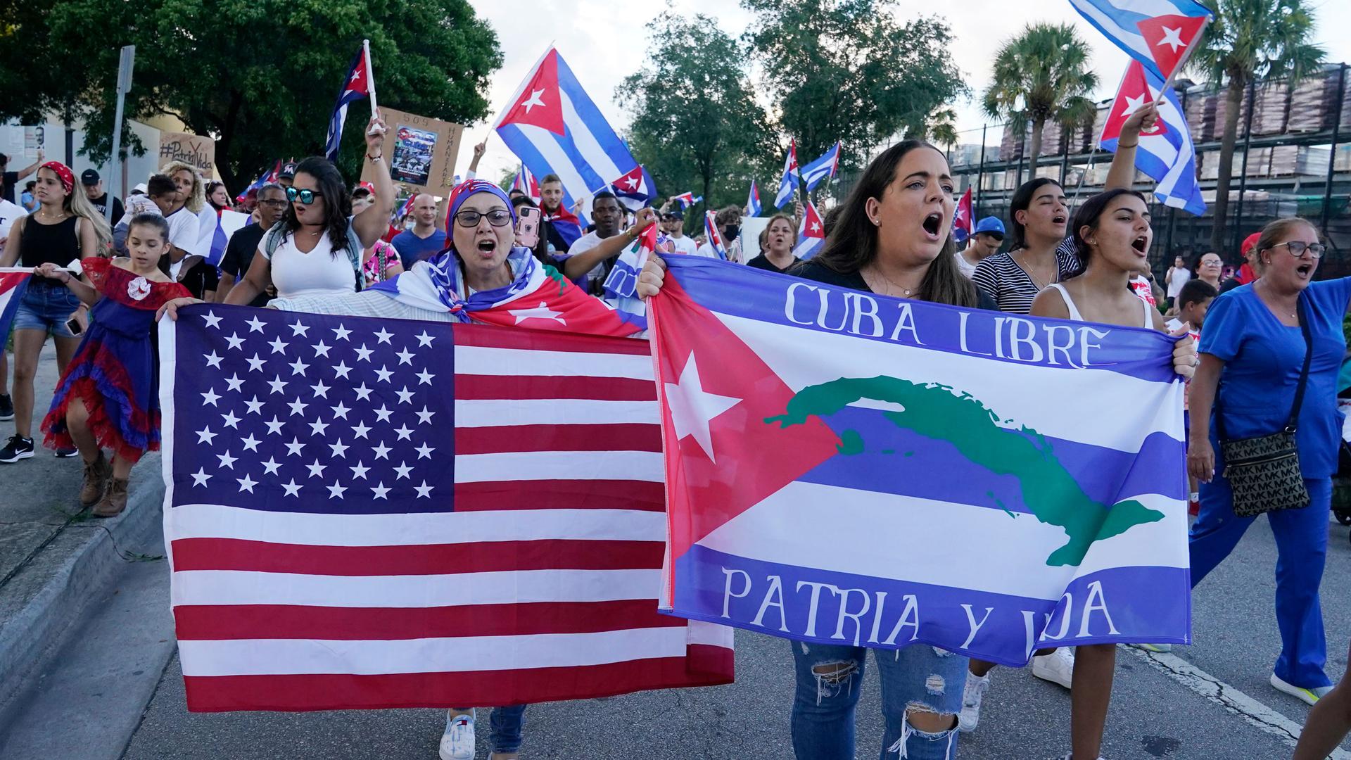 Demonstrators shout their solidarity with the Cuban people against the communist government, Thursday, July 15, 2021, in Hialeah, Florida. Hialeah has the greatest concentration of Cuban exiles in the US.