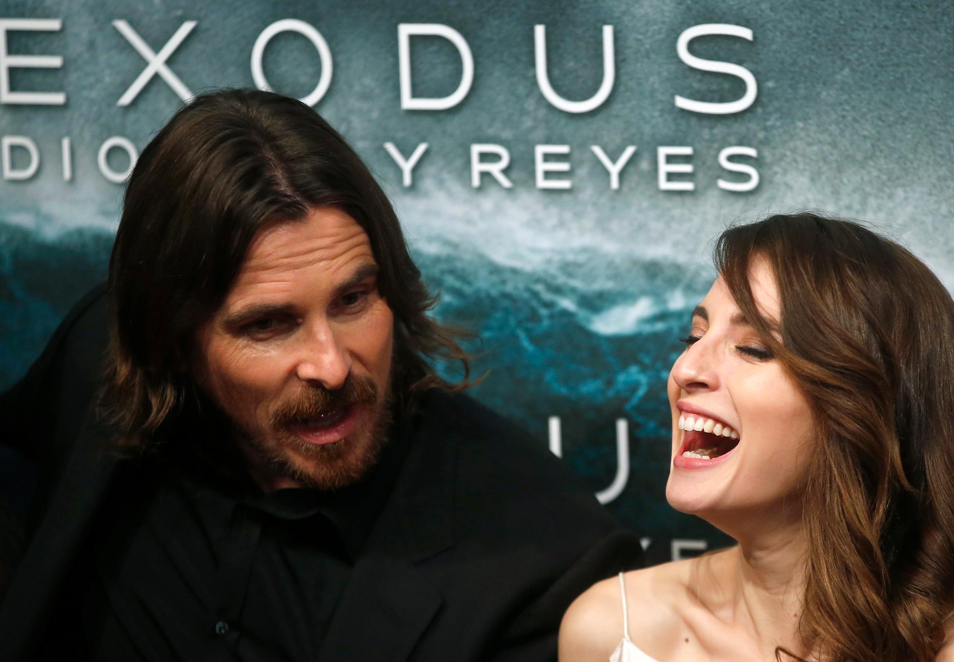 Cast members Christian Bale and Maria Valverde pose for photographs as they arrive for the film world premiere of "Exodus: Gods and Kings" in Madrid, Spain.
