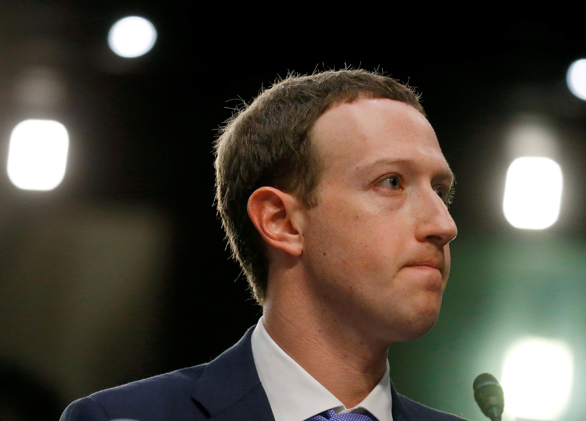 Facebook CEO Mark Zuckerberg listens while testifying before a joint Senate