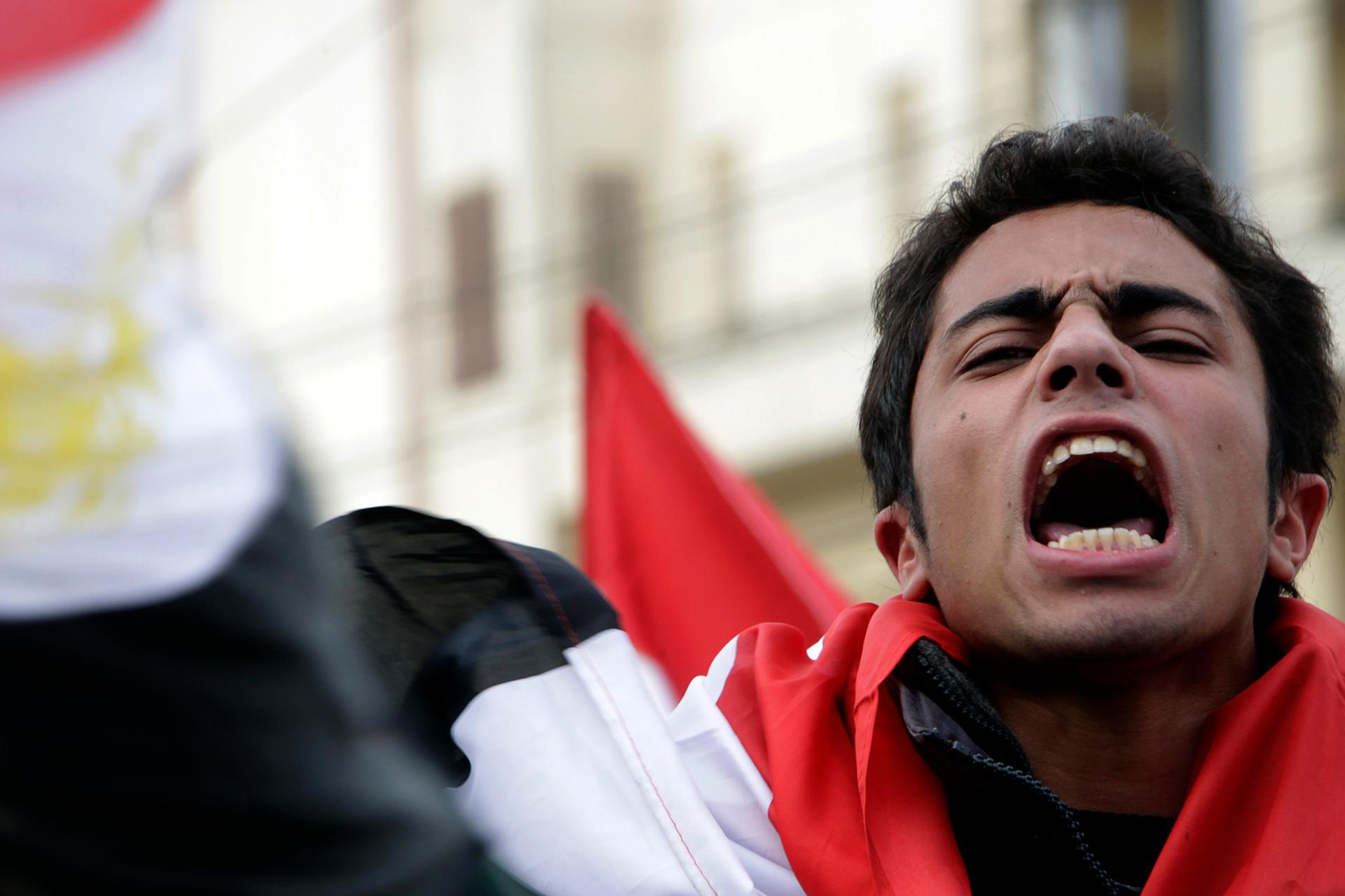 An anti-government protester participates in demonstrations against Egyptian President Hosni Mubarakin in front of the presidential palace in Cairo, Feb. 11, 2011.