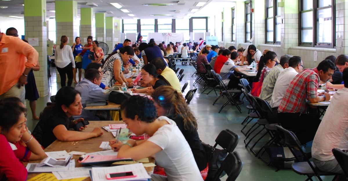 Nepali immigrants registerf or TPS at a clinic at highschool in Queens organized by Adhikaar last March.