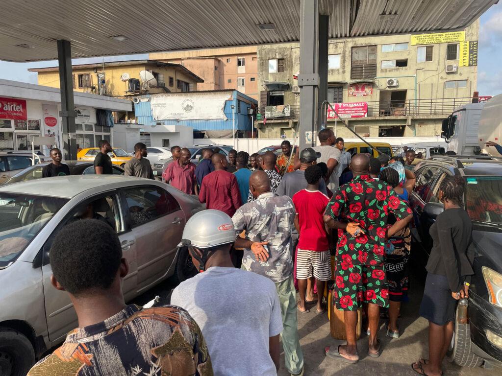 Fuel stations in Lagos are chaotic scenes as scores scramble to buy the essential commodity.