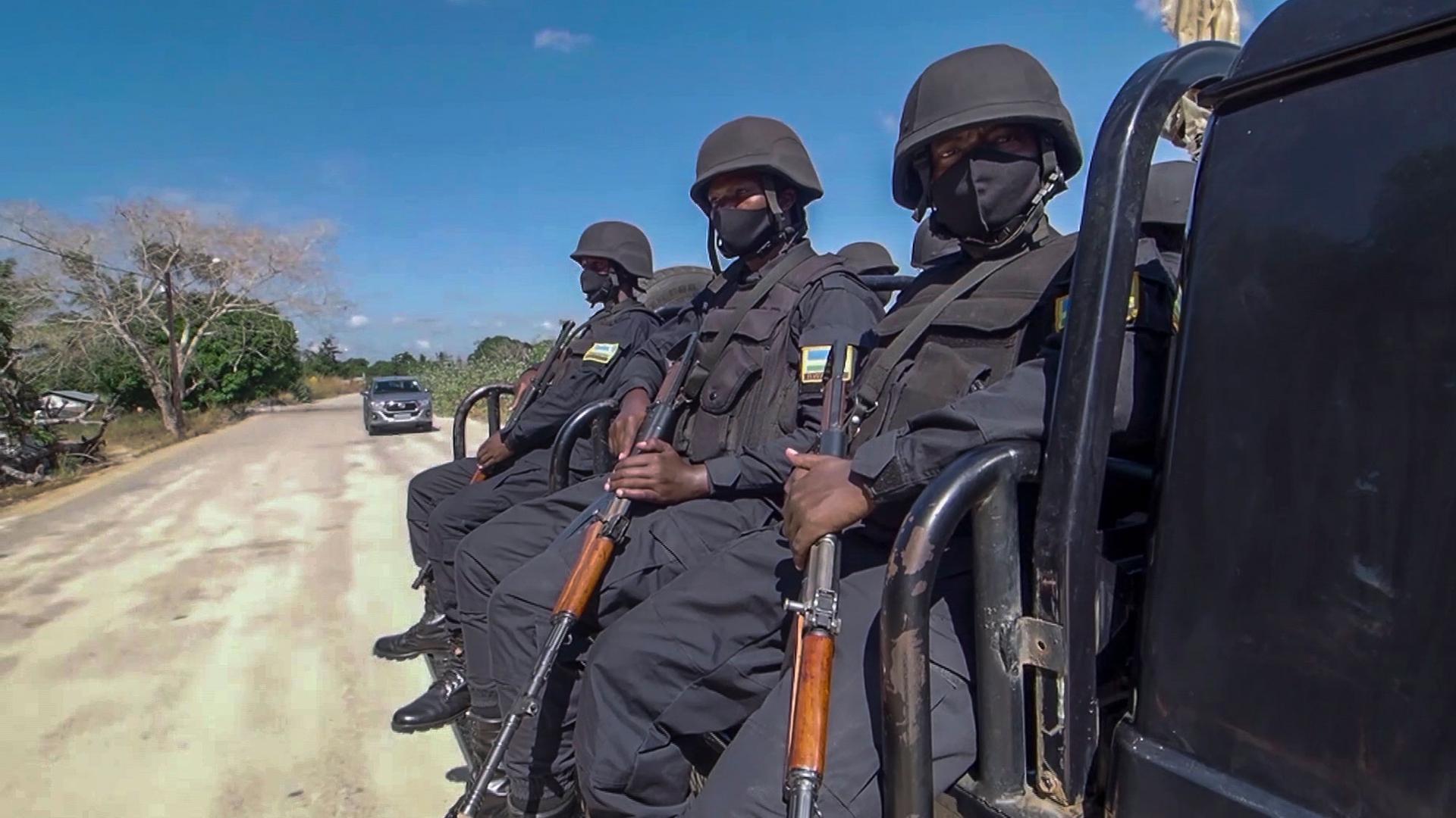 In this image made from video, Rwandan policemen patrol near the Amarula Palma hotel in Palma, Cabo Delgado province, Mozambique, Sunday, Aug. 15, 2021.
