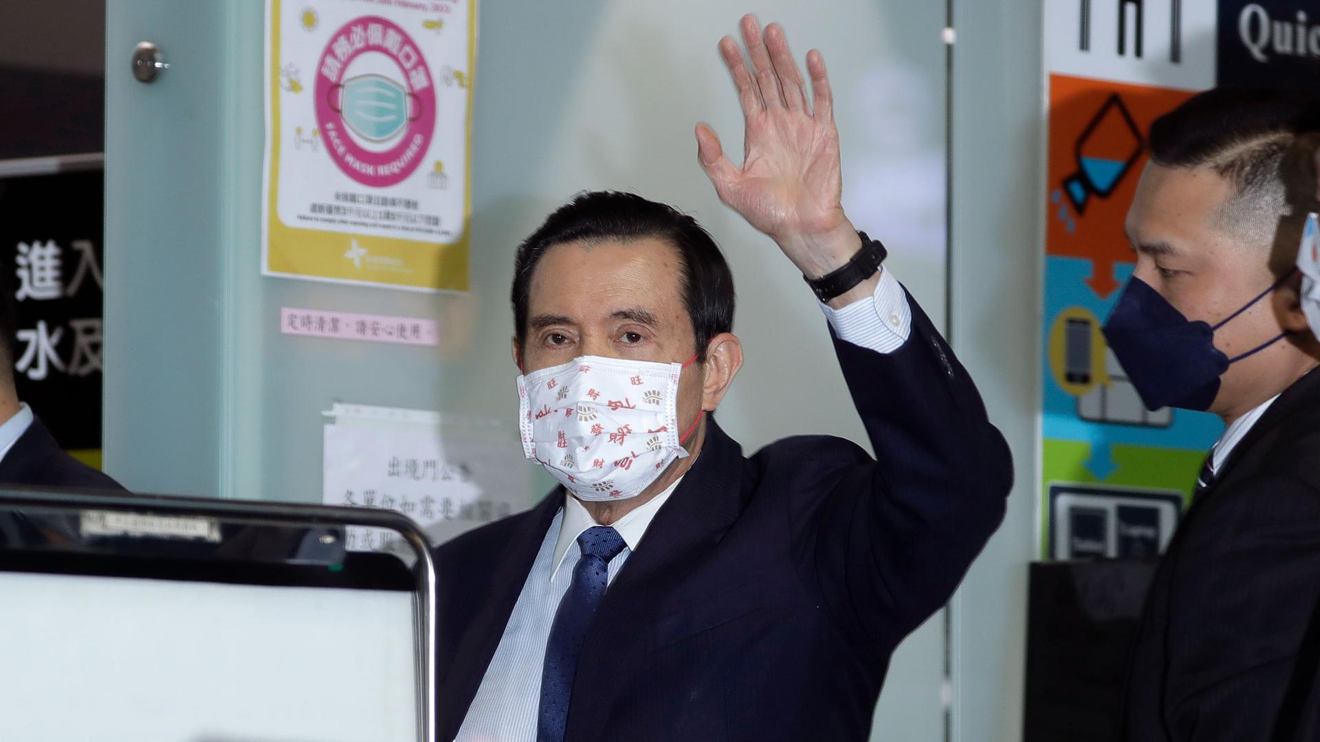 Former Taiwan President Ma Ying-jeou waves as Ma leaves for China, at Taoyuan International Airport in Taoyuan City, northern Taiwan, Monday, March 27, 2023.