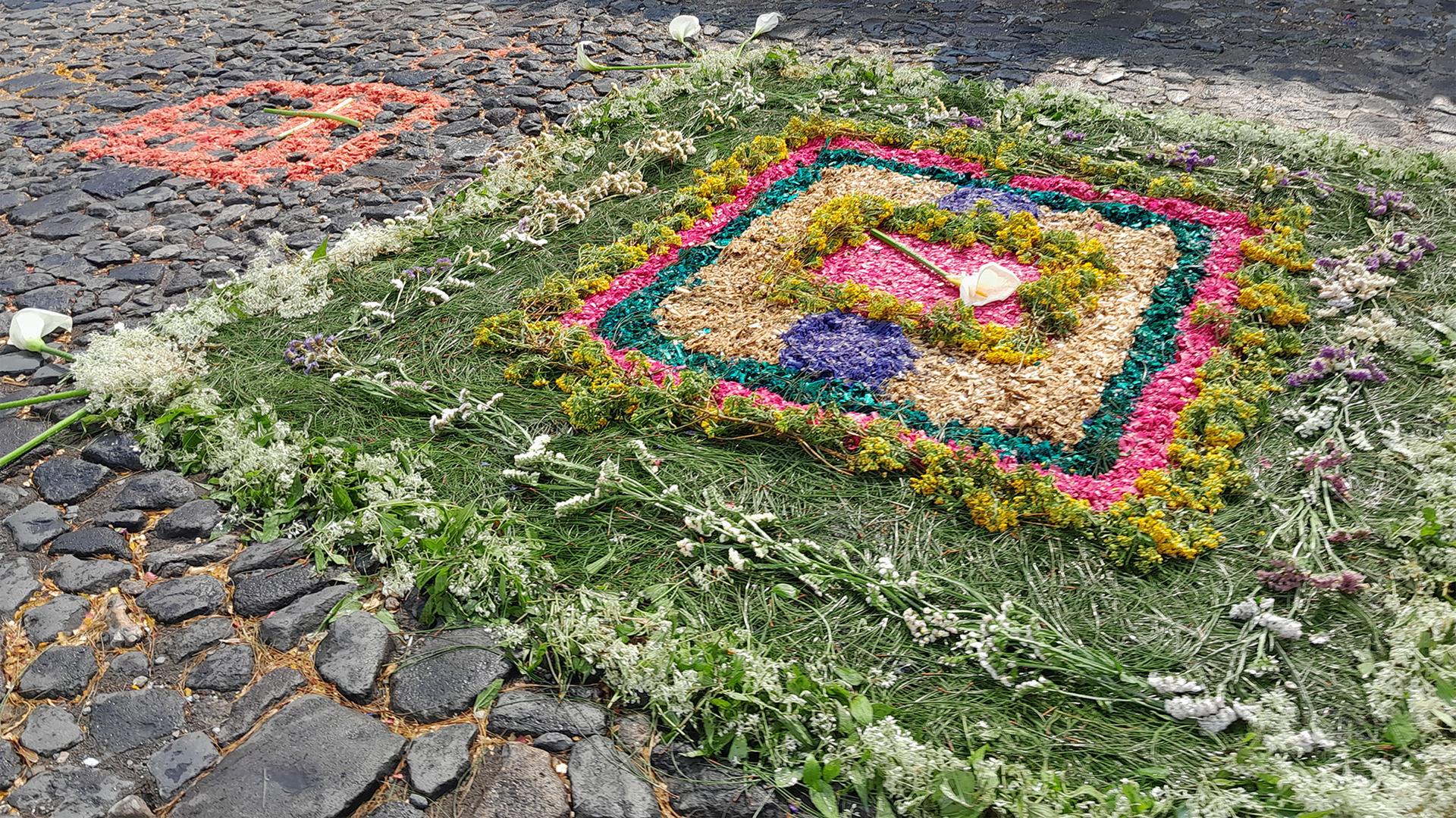 A decorated street carpet known as an alfombra created for Holy Week in Antigua, Guatemala.