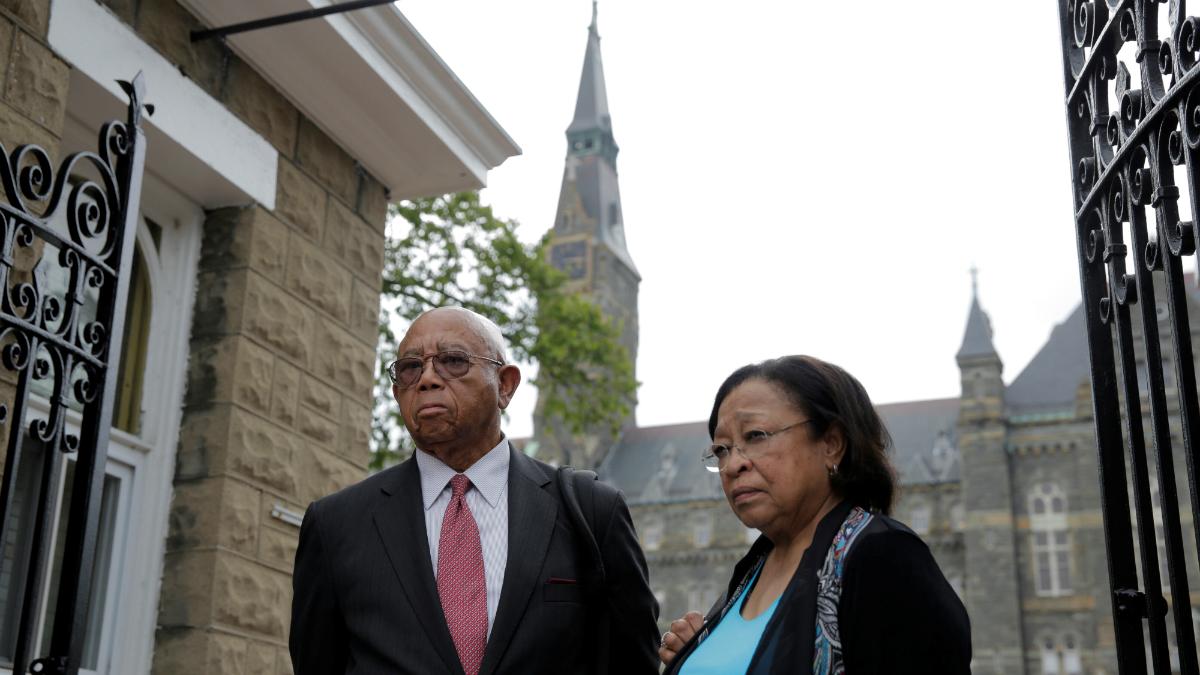 Joe Stewart and Patricia Bayonne-Johnson, both descendants of people sold as slaves by Georgetown University, visit the school on September 1, 2016 in Washington, D.C.