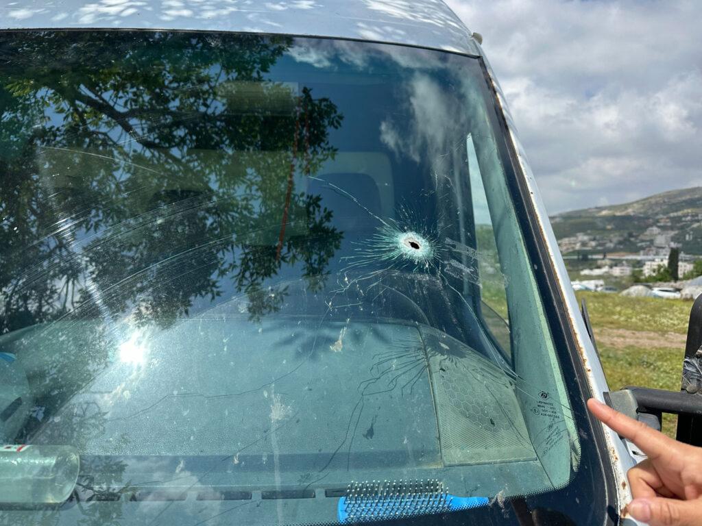 The bullet hole in the van that resulted in Amer's death.
