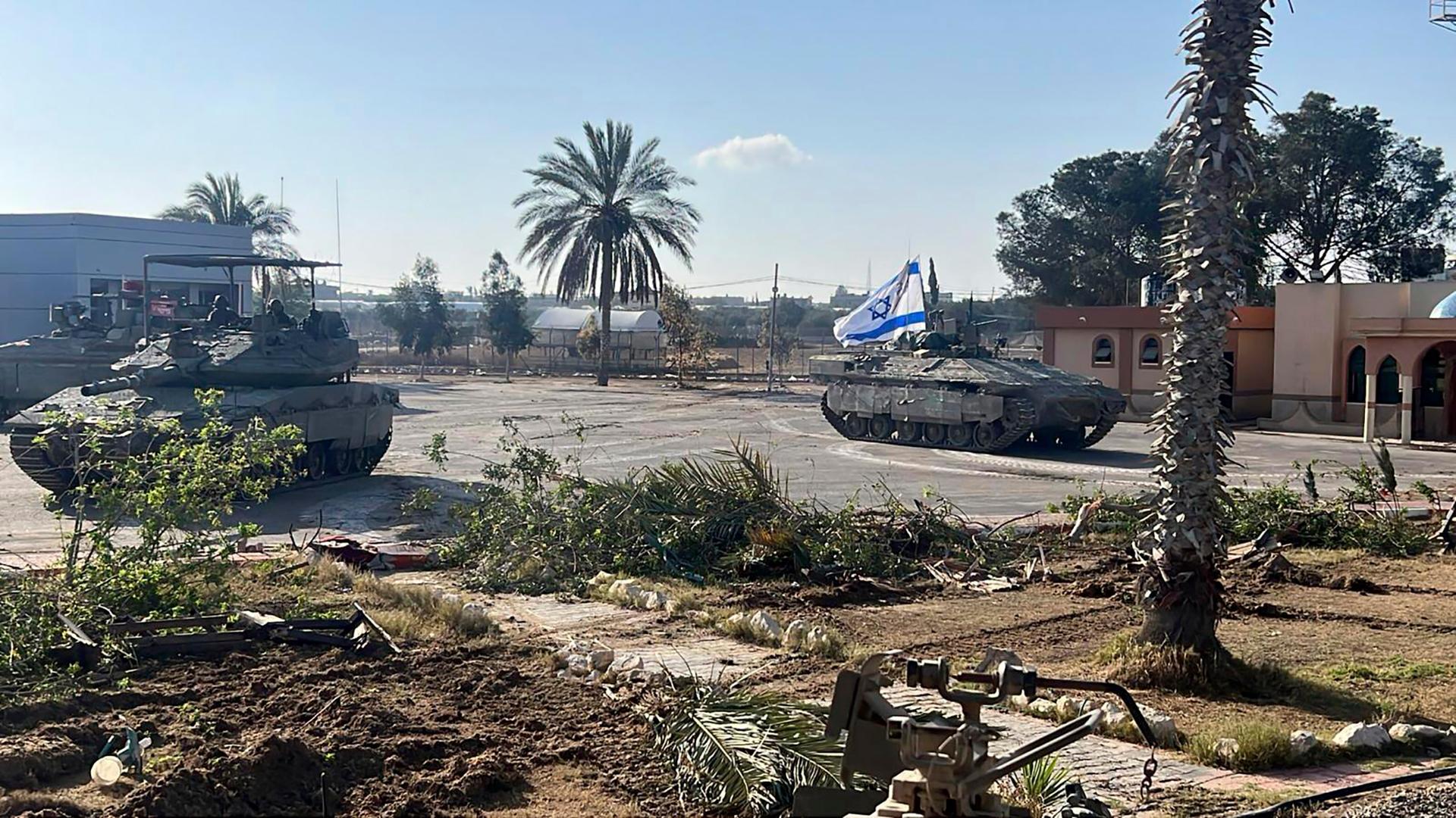 This photo provided by the Israel Defense Forces shows a tank with an Israel flag on it entering the Gazan side of the Rafah border crossing on Tuesday, May 7, 2024.