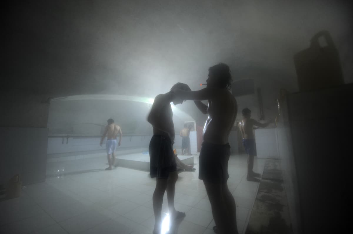 Afghan men wash at a traditional 'hamam' bathhouse in Mazar-i-Sharif in January 2014.