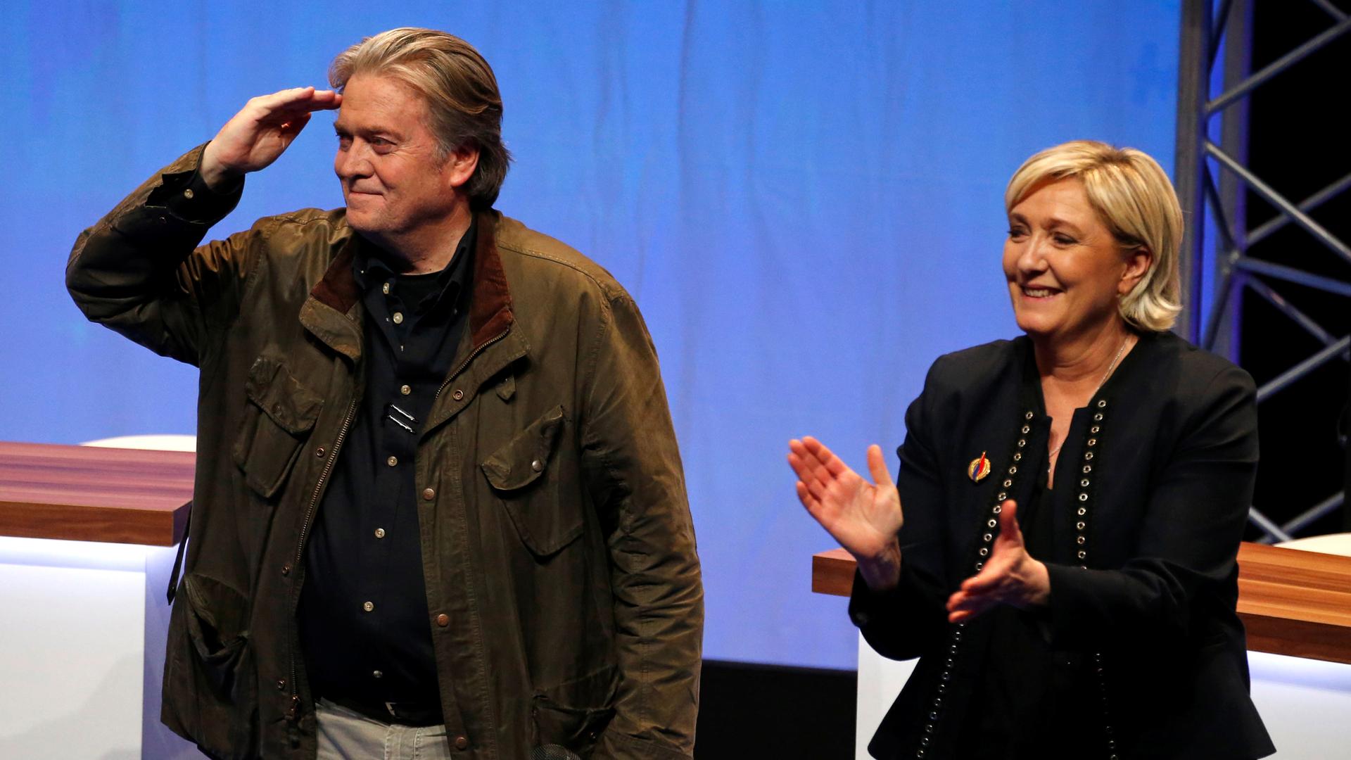 Marine Le Pen, National Front political party leader (right), and Former White House Chief Strategist Steve Bannon attend the party's convention in Lille, France, March 10, 2018.