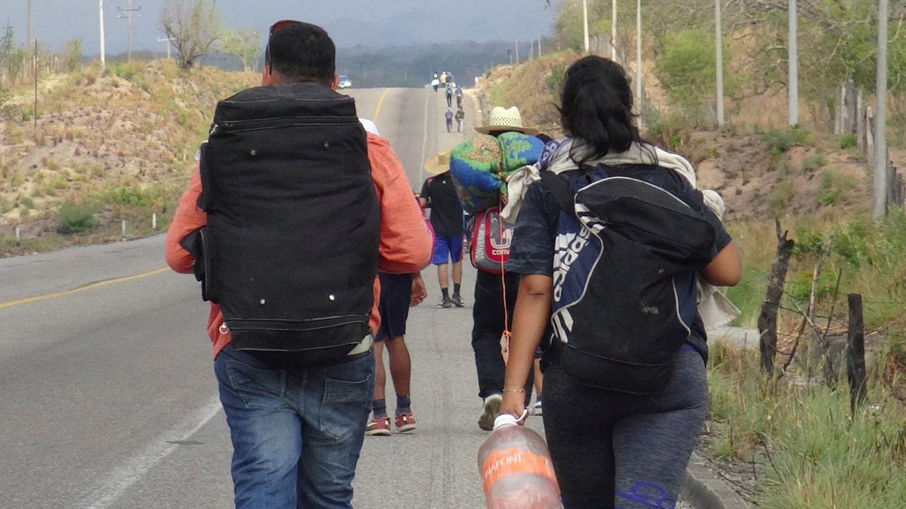 Central American migrants arrive walk along the roads of Ixtepec, Oaxaca, Mexico.