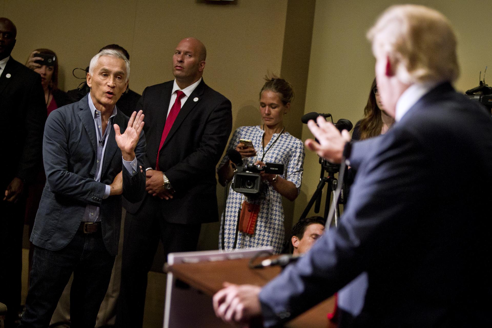 Then Republican presidential candidate Donald Trump spars with Univision reporter Jorge Ramos in Dubuque, Iowa, August 25, 2015. Ramos was removed from Trump's news conference.