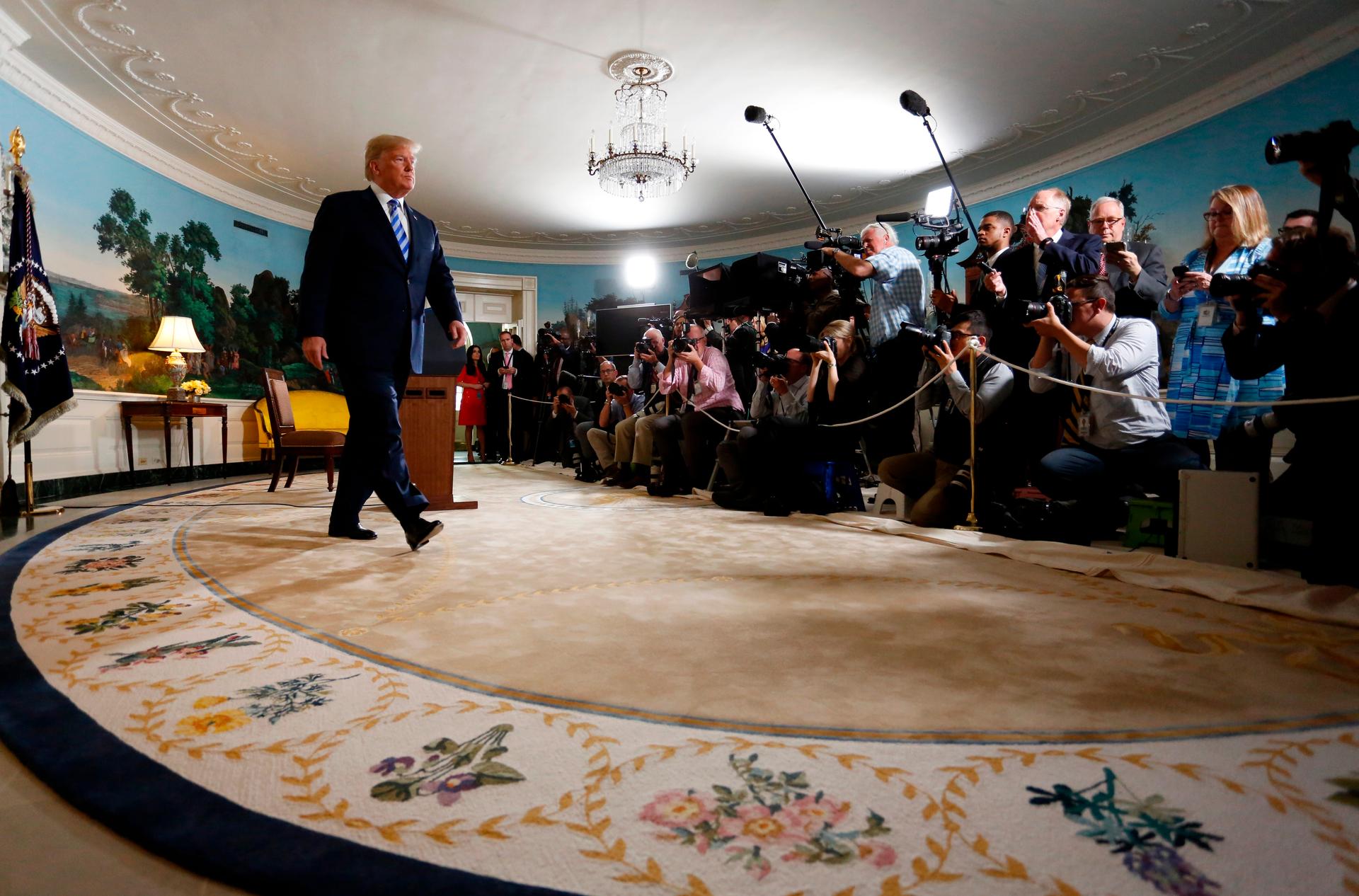 President Donald Trump walks away from the podium after announcing his intention to withdraw from the Iran nuclear agreement, May 8, 2018.