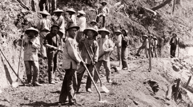 Chinese railroad workers building US transcontinental railway in the 19th century