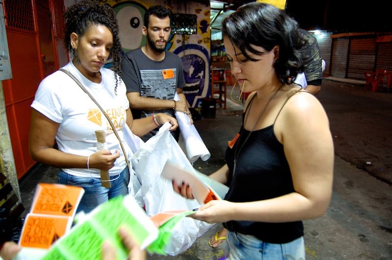 College student Fernanda Garcia (right) speaks with fellow activists