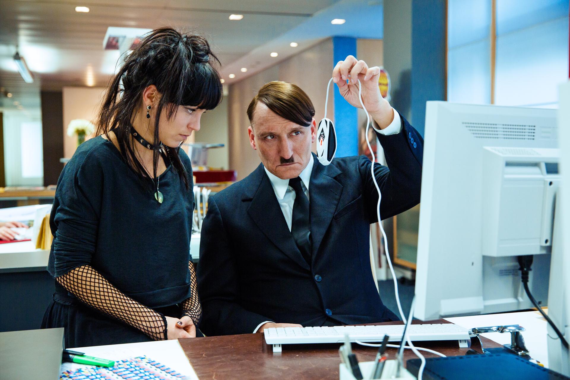 Hitler trying to learn how to use a computer and mouse
