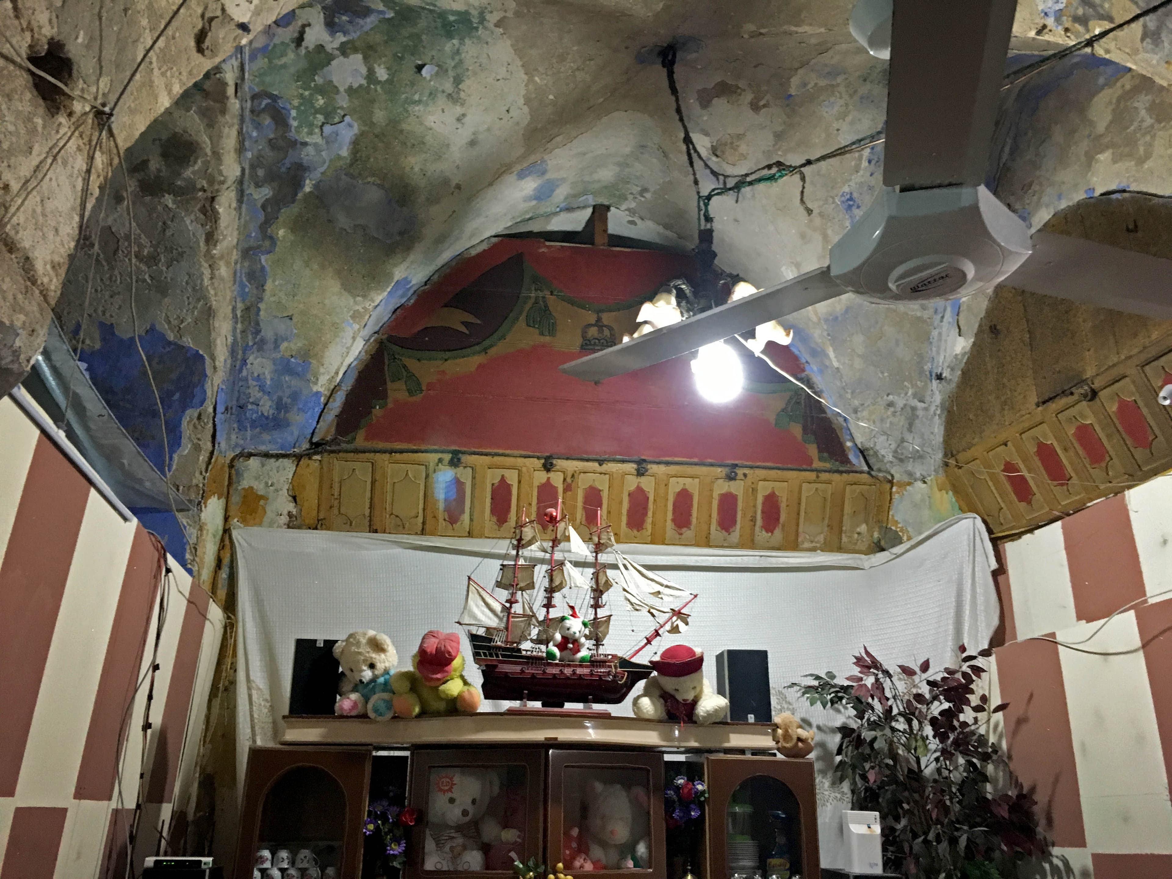When he moved in, Jihad Al-Mohammed didn't realize his home had been a synagogue. You can still see Jewish stars on the walls, though the Hebrew letters have been painted over.