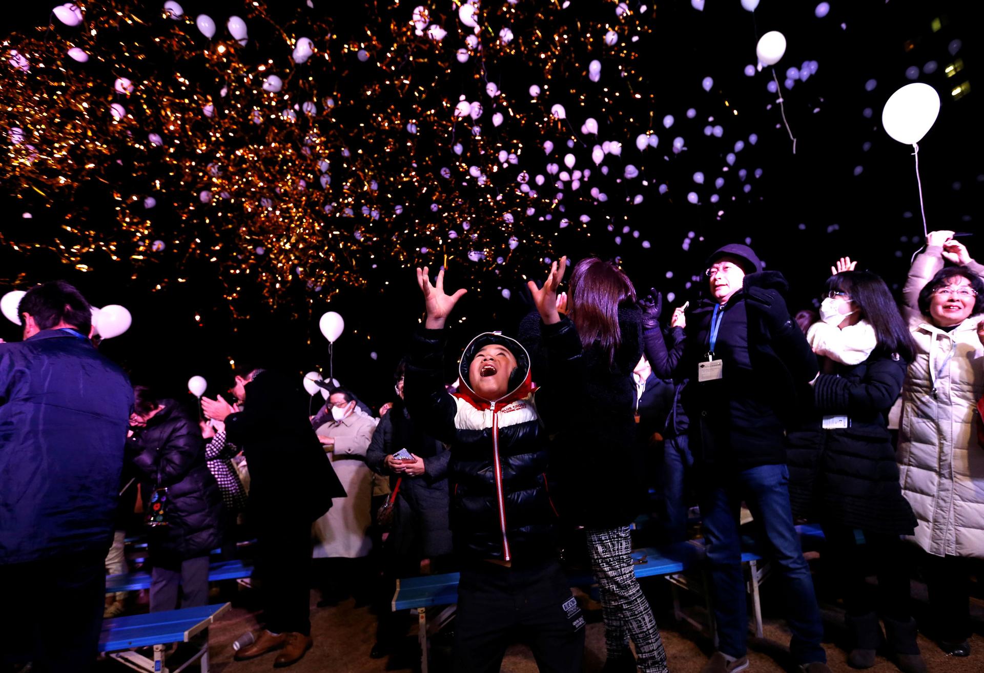 Revellers release balloons as they take part in New Year celebrations in Tokyo, Japan.