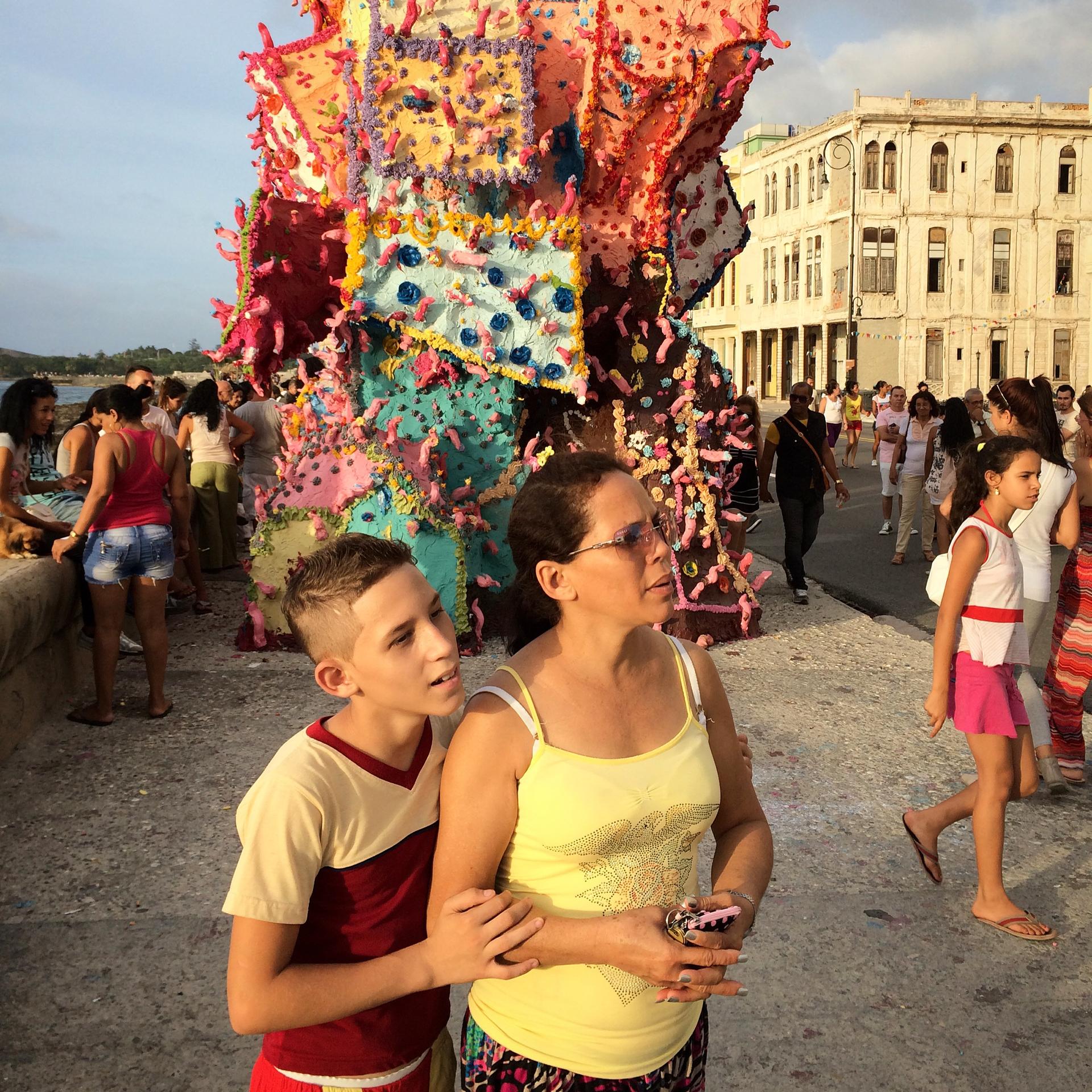 A mom and her son look at art installations along Havana's famous sea-facing esplanade, the Malecón. The entire collection of art here is called 