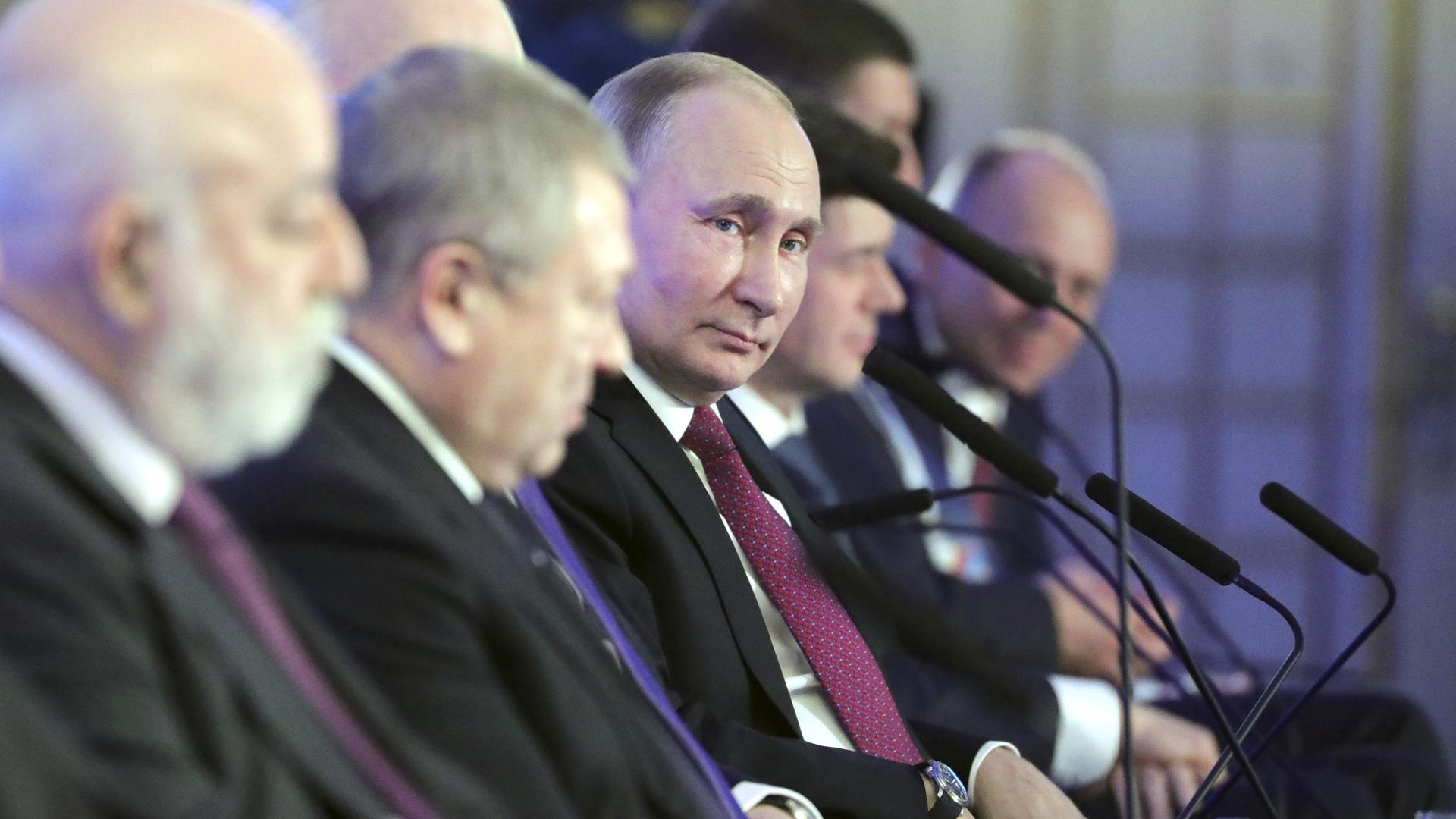 Russian President Vladimir Putin attends a session during the Week of Russian Business, in Moscow.