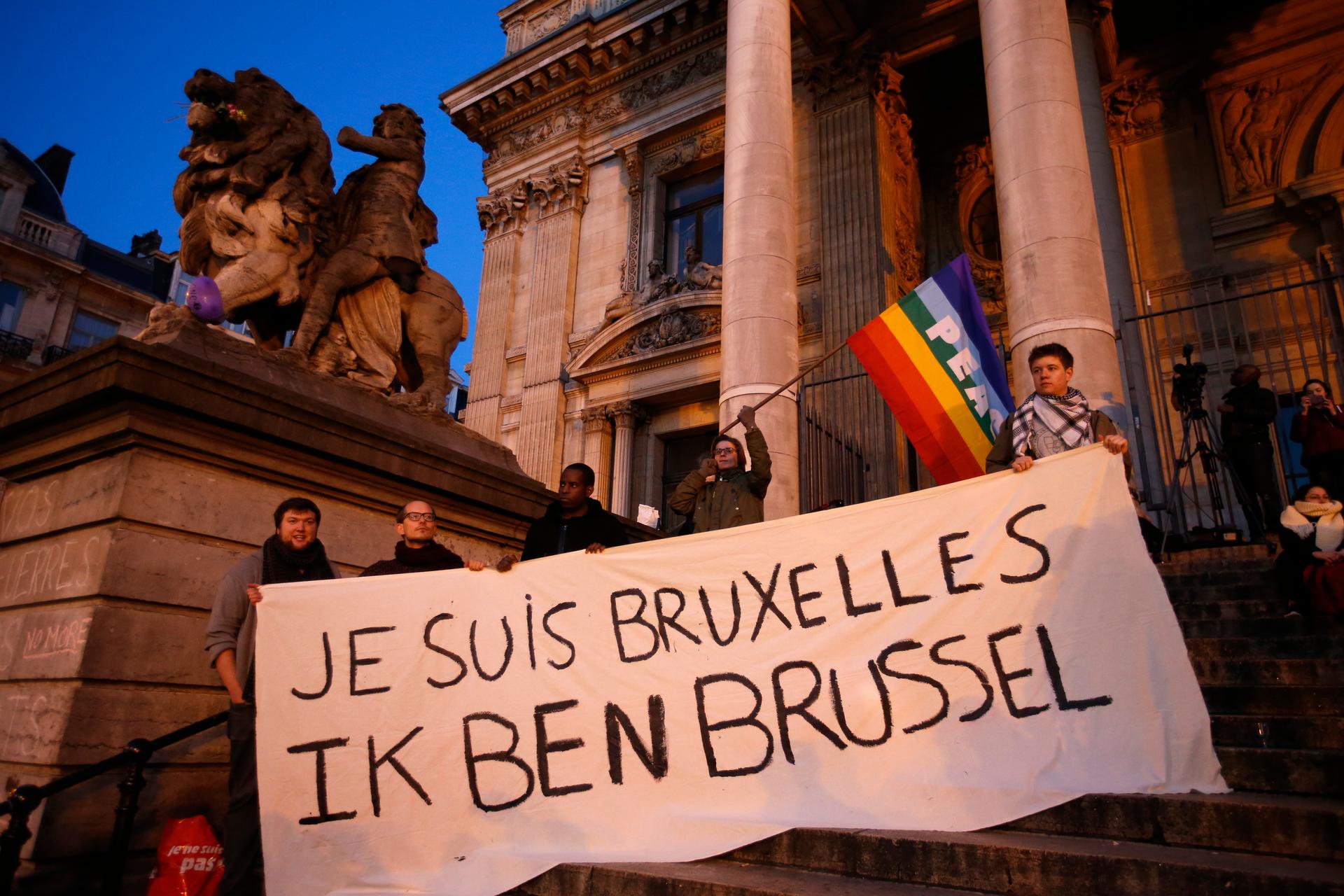 People diaplay a solidarity banner on the steps of the old stock exchange building in Brussels following bomb attacks in Brussels, Belgium, March 22. The banner reads 