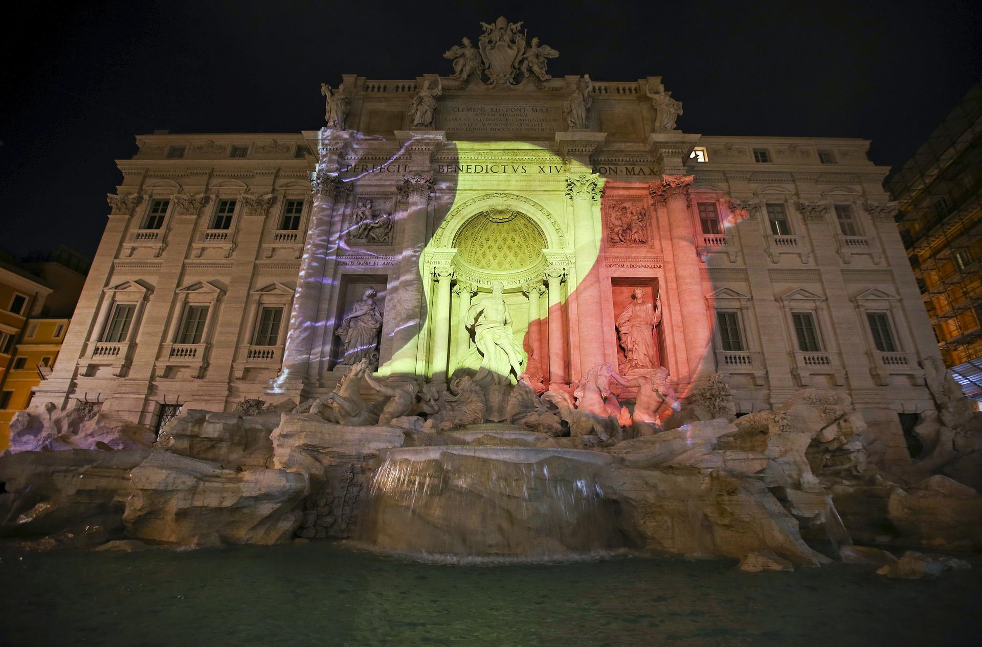 The black, yellow, and red colours of the Belgian flag are projected on the Trevi fountain in Rome, Italy, in tribute to the victims of today's Brussels bomb attacks March 22, 2016.