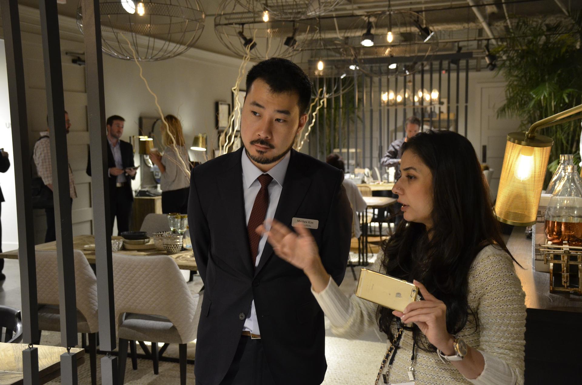 Smita Prakash and Matthew Kim look at furnishings at Universal Furniture’s showroom in High Point.