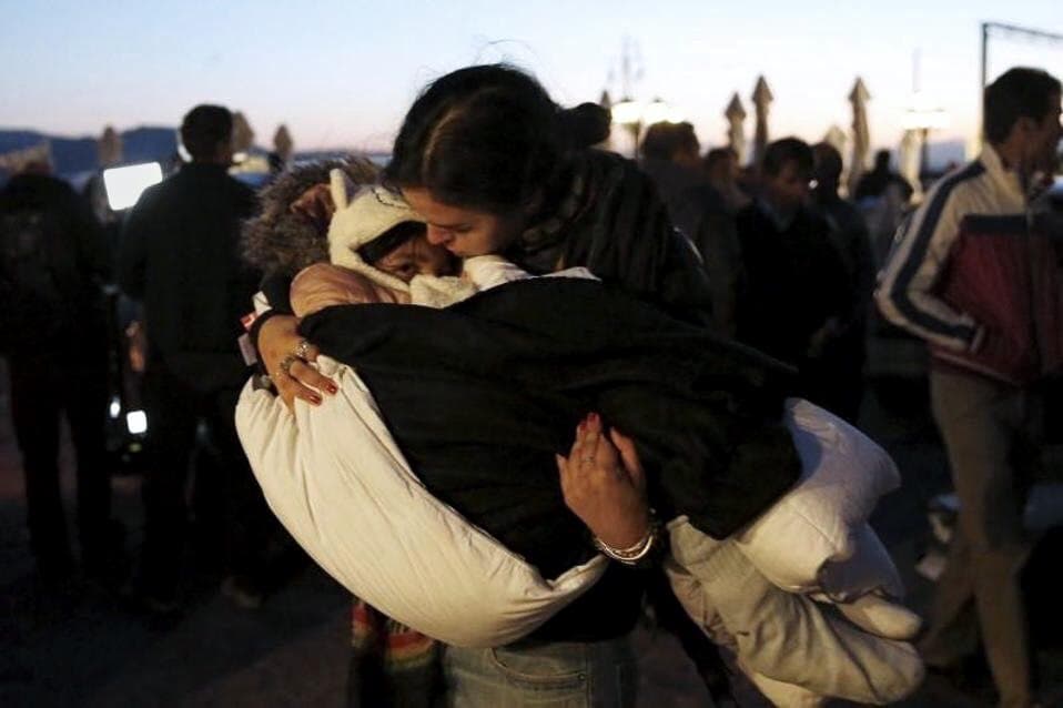Erin Schrode with a young Syrian refugee.