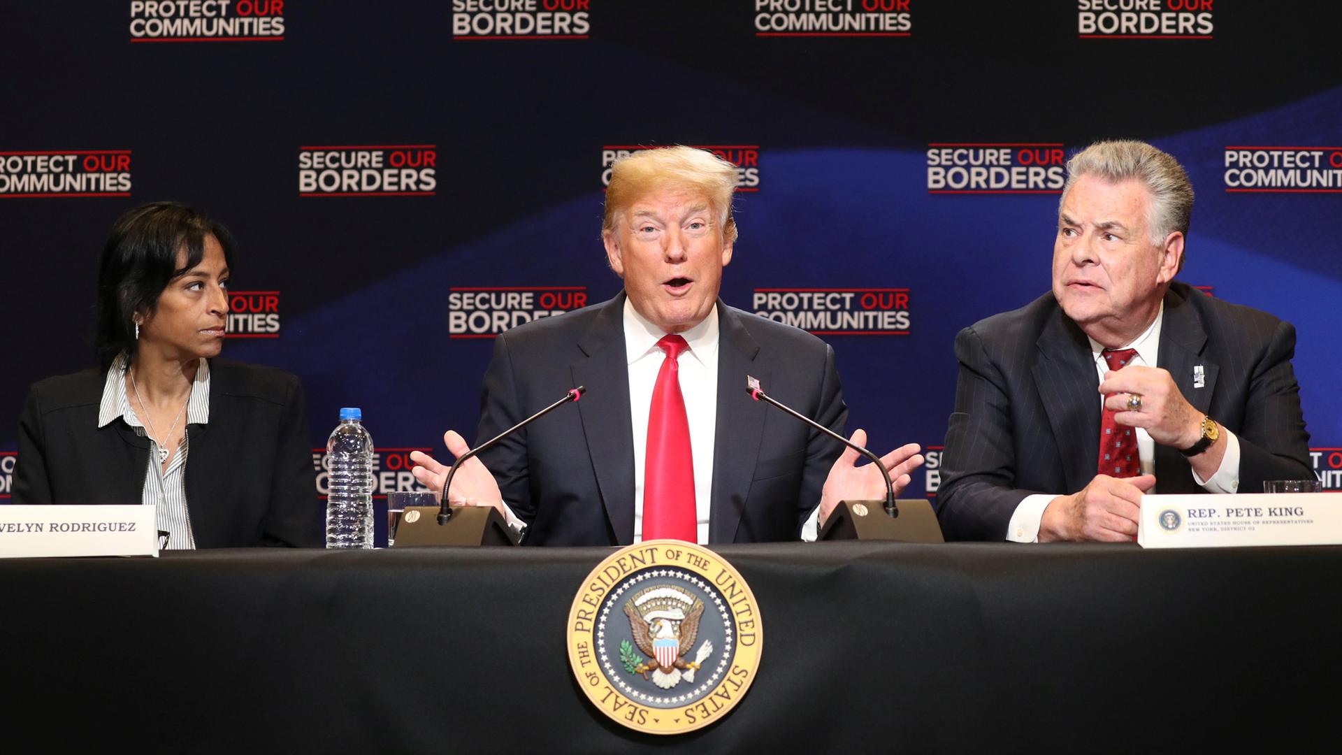 US President Donald Trump gestures with his hands and a woman on the left and a man on the right, watch.