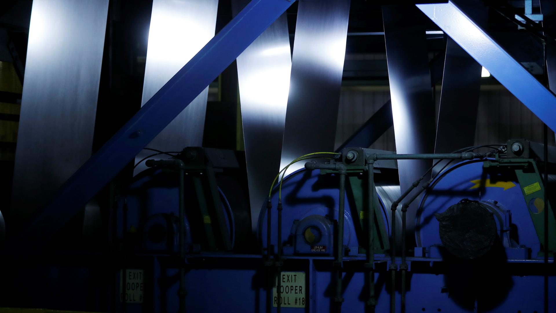 Steel goes through machinery at the ArcelorMittal Dofasco steel plant in Hamilton, Ontario, Canada, March 13, 2018.