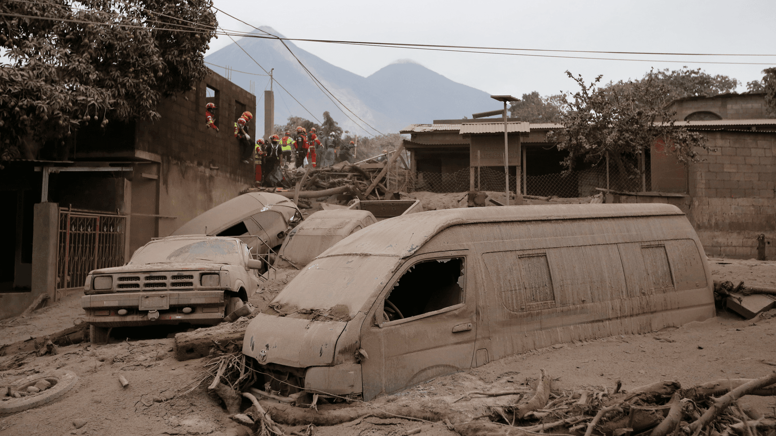 Rescue workers search for survivors and victims in the aftermath of Fuego volcano's eruption