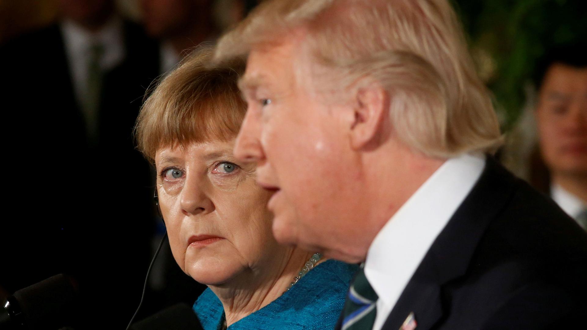 Germany's Chancellor Angela Merkel and President Donald Trump hold a joint news conference in the East Room of the White House in Washington, DC, March 17, 2017.