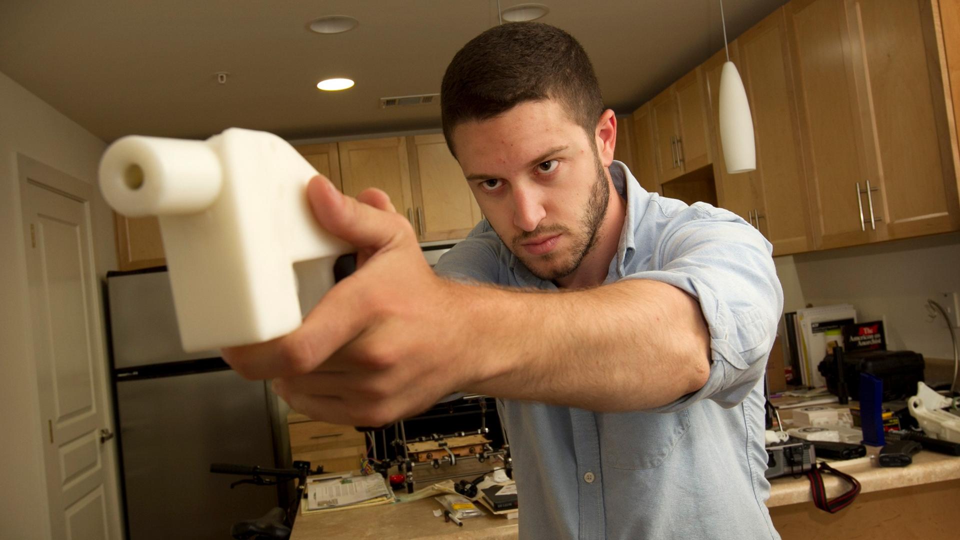 Cody Wilson shows off his 3D-printed handgun at his home in Austin, TX, 2013.