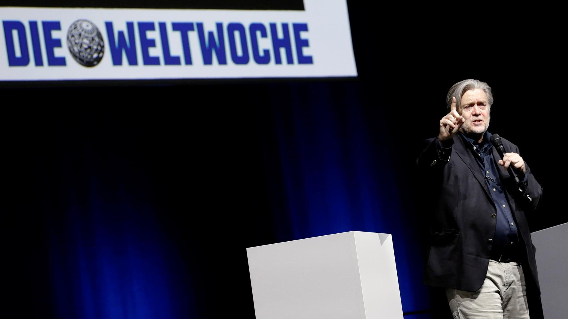 Former White House Chief Strategist Steve Bannon is shown pointing with his right hand while speaking during a conference in Zurich, Switzerland, March 2018.