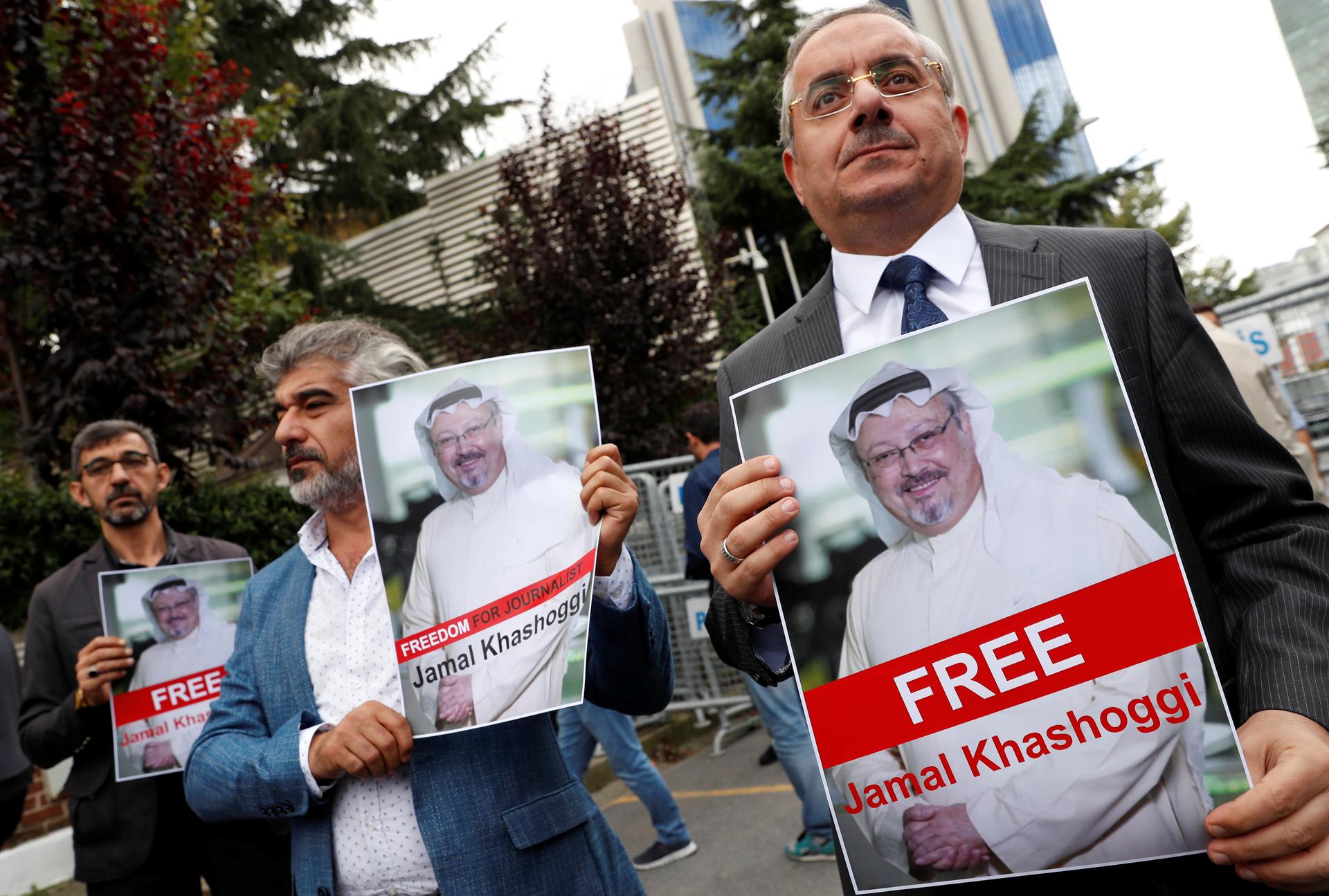 Human rights activists and friends of Saudi journalist Jamal Khashoggi hold his pictures during a protest outside the Saudi Consulate in Istanbul, Turkey October 8, 2018.