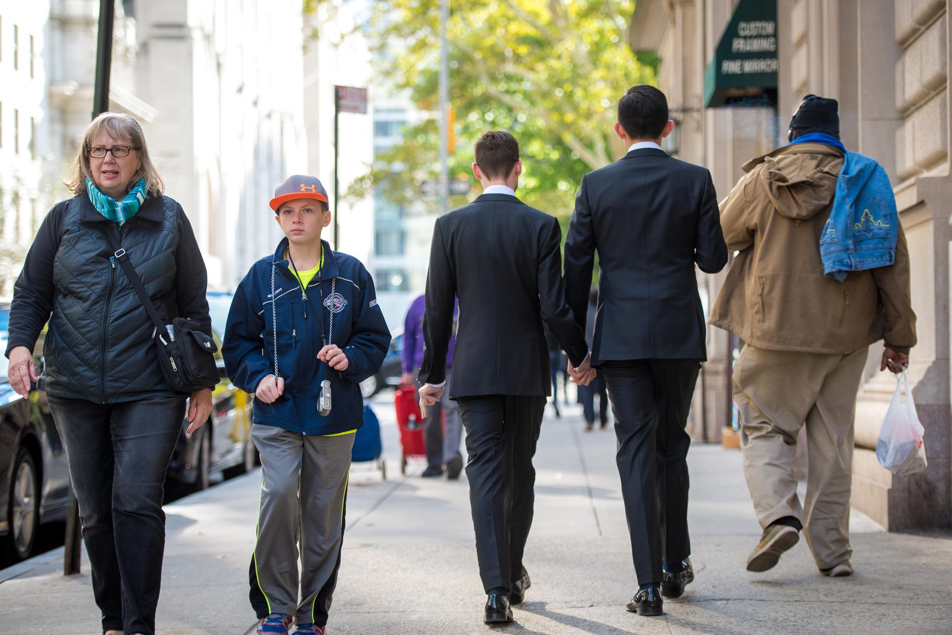 Two men in suits walking down New York steet