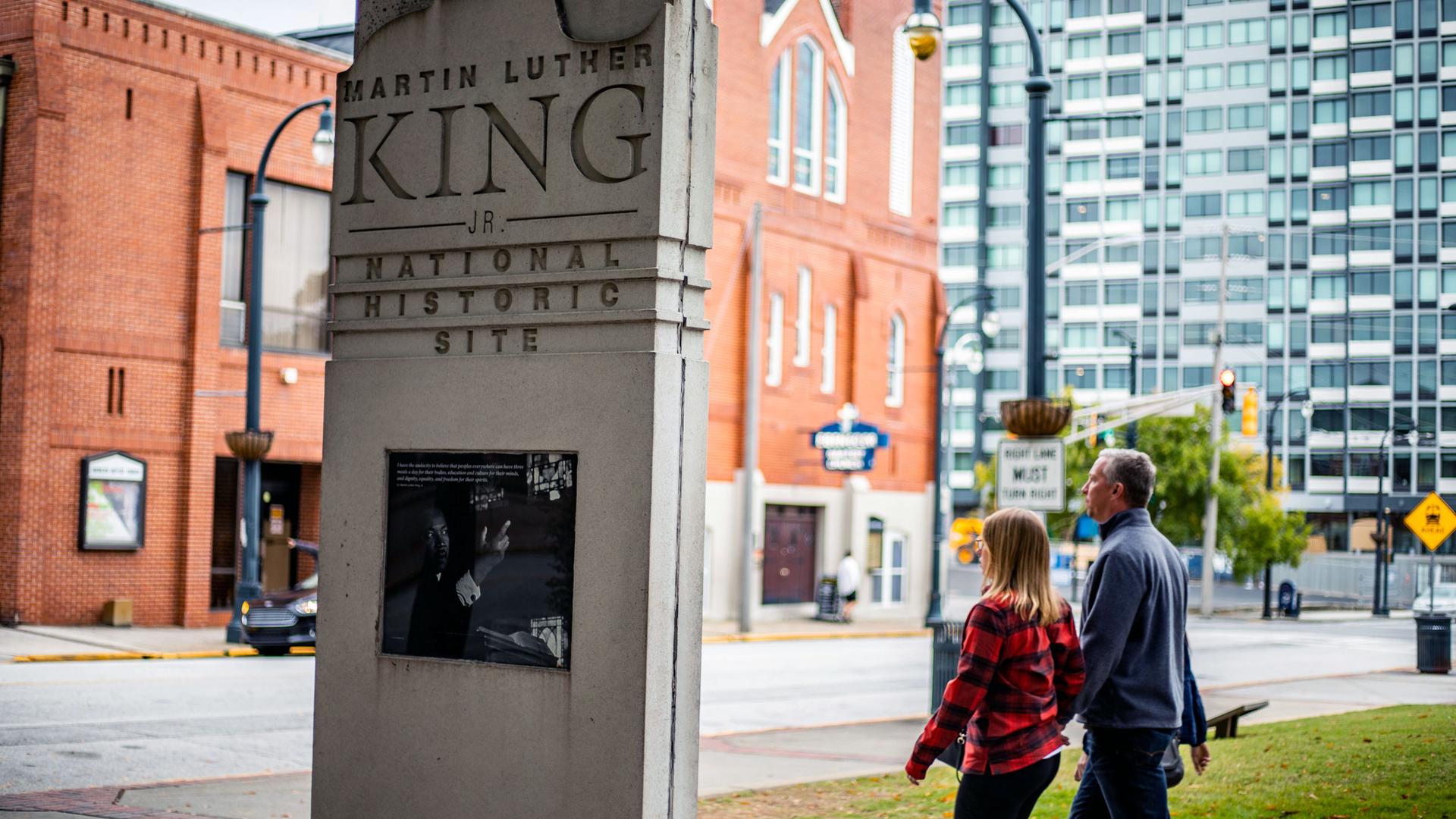 People walk by the MLK historical site in downtown Atlanta.