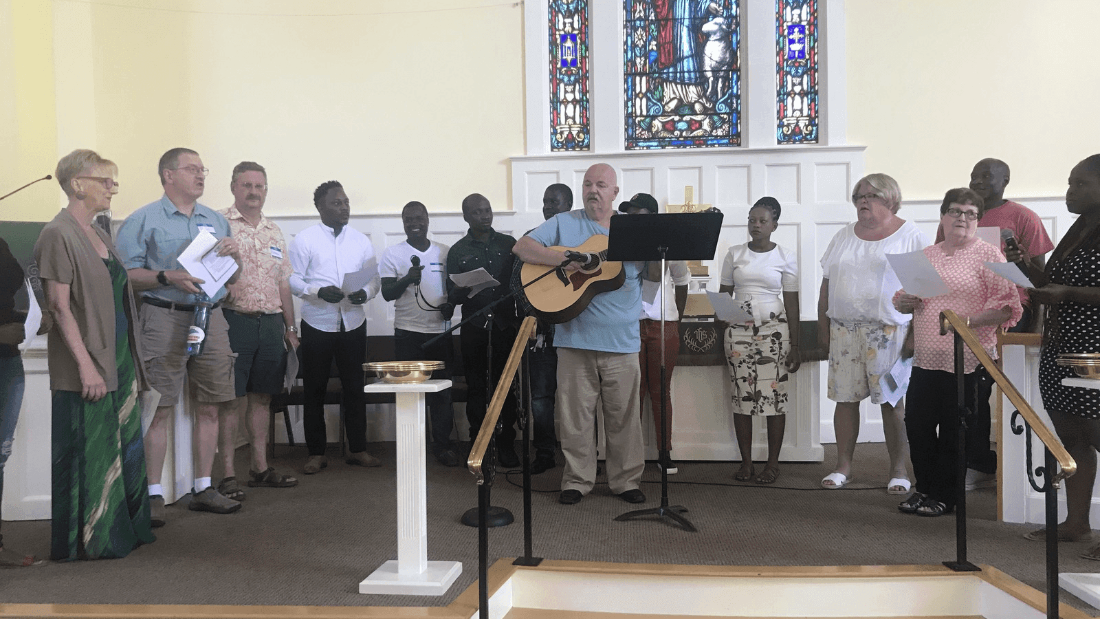 asylum-seekers sing in a church choir