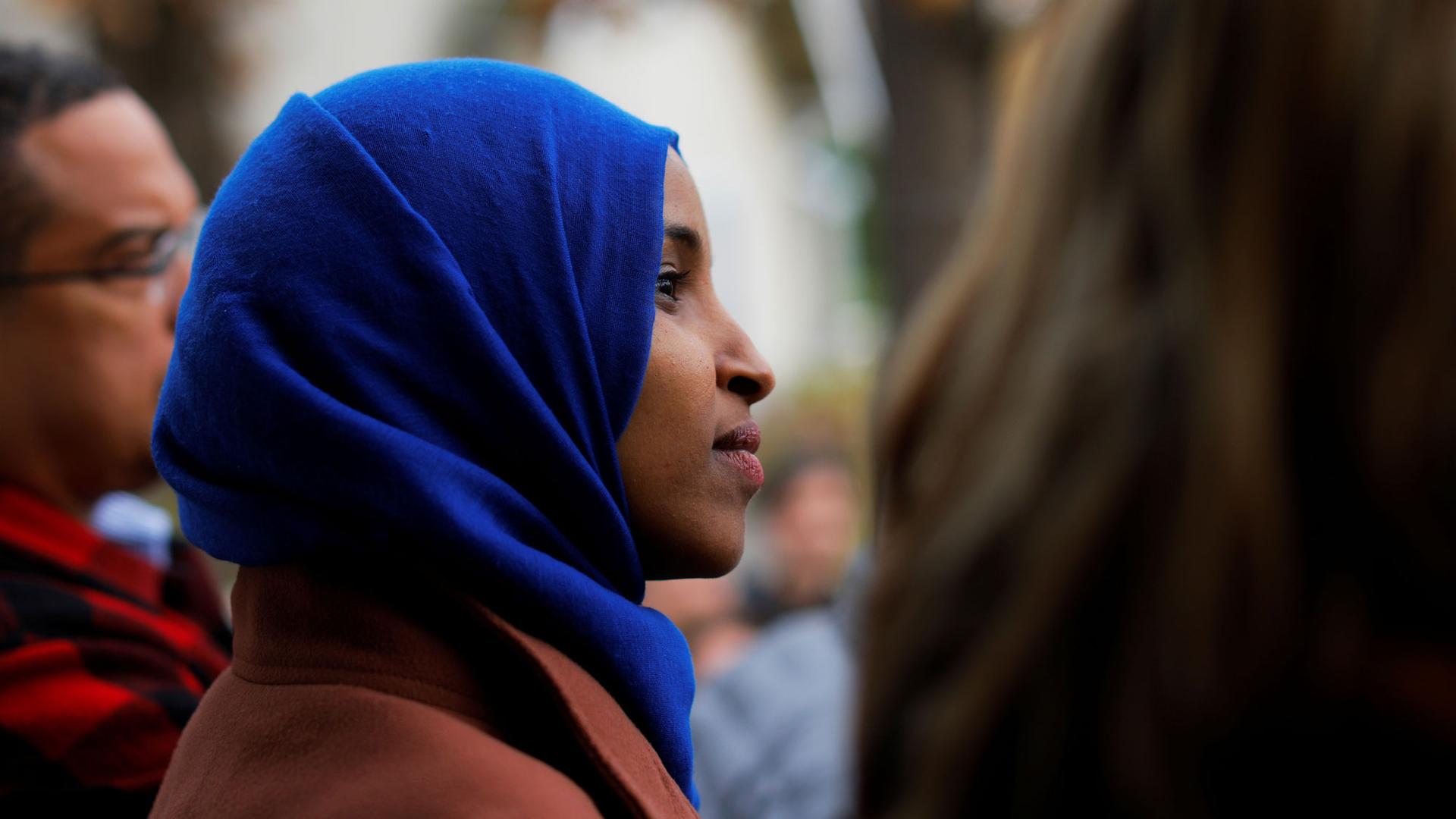 US Democratic congressional candidate Ilhan Omar is shown in profile wearing a blue scarf.