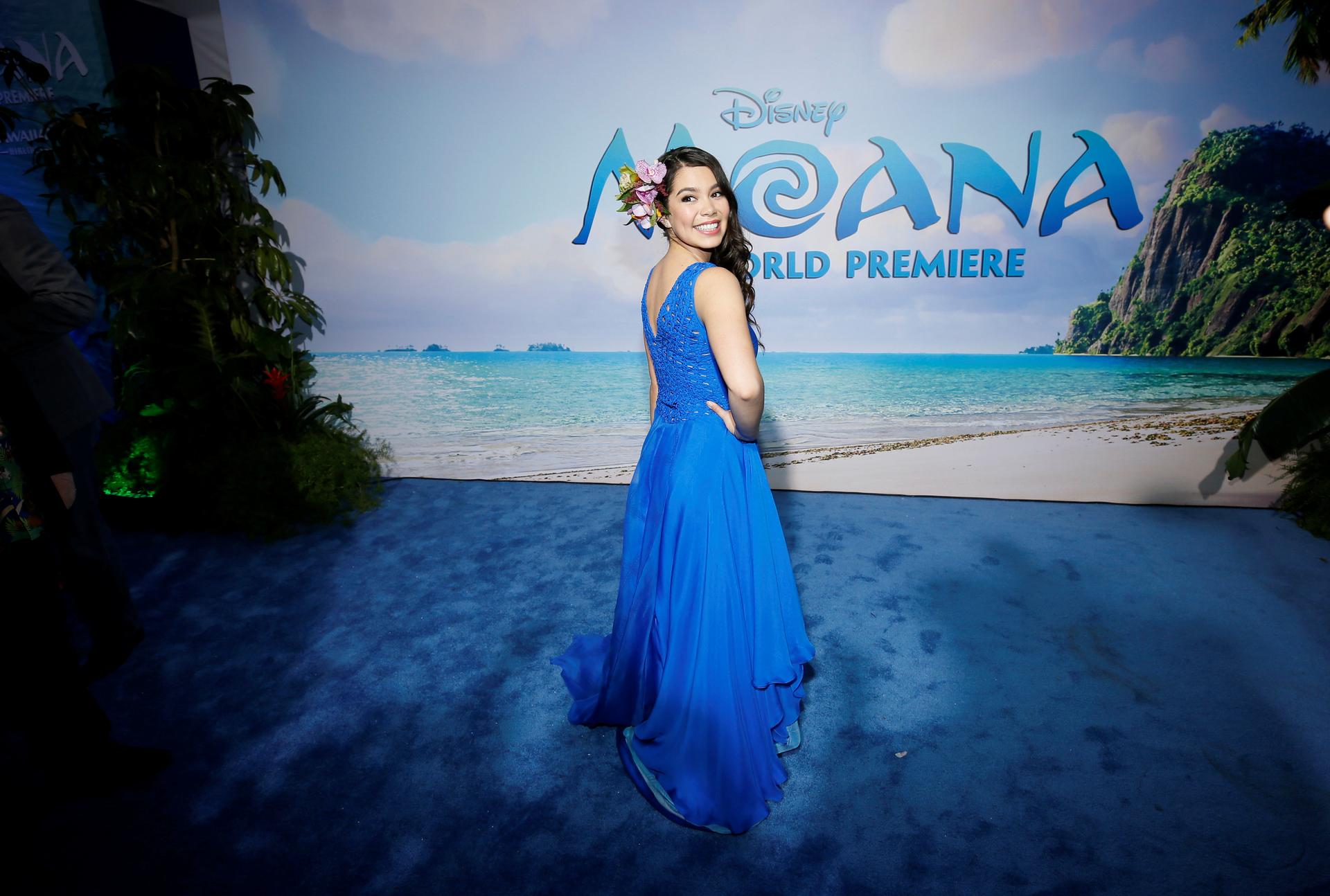 Auli'i Cravalho in a long blue dress