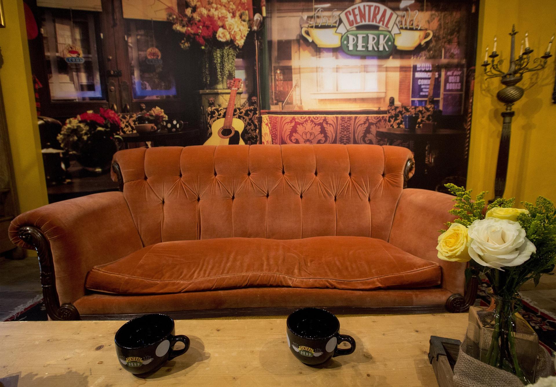 an orange couch in a cafe