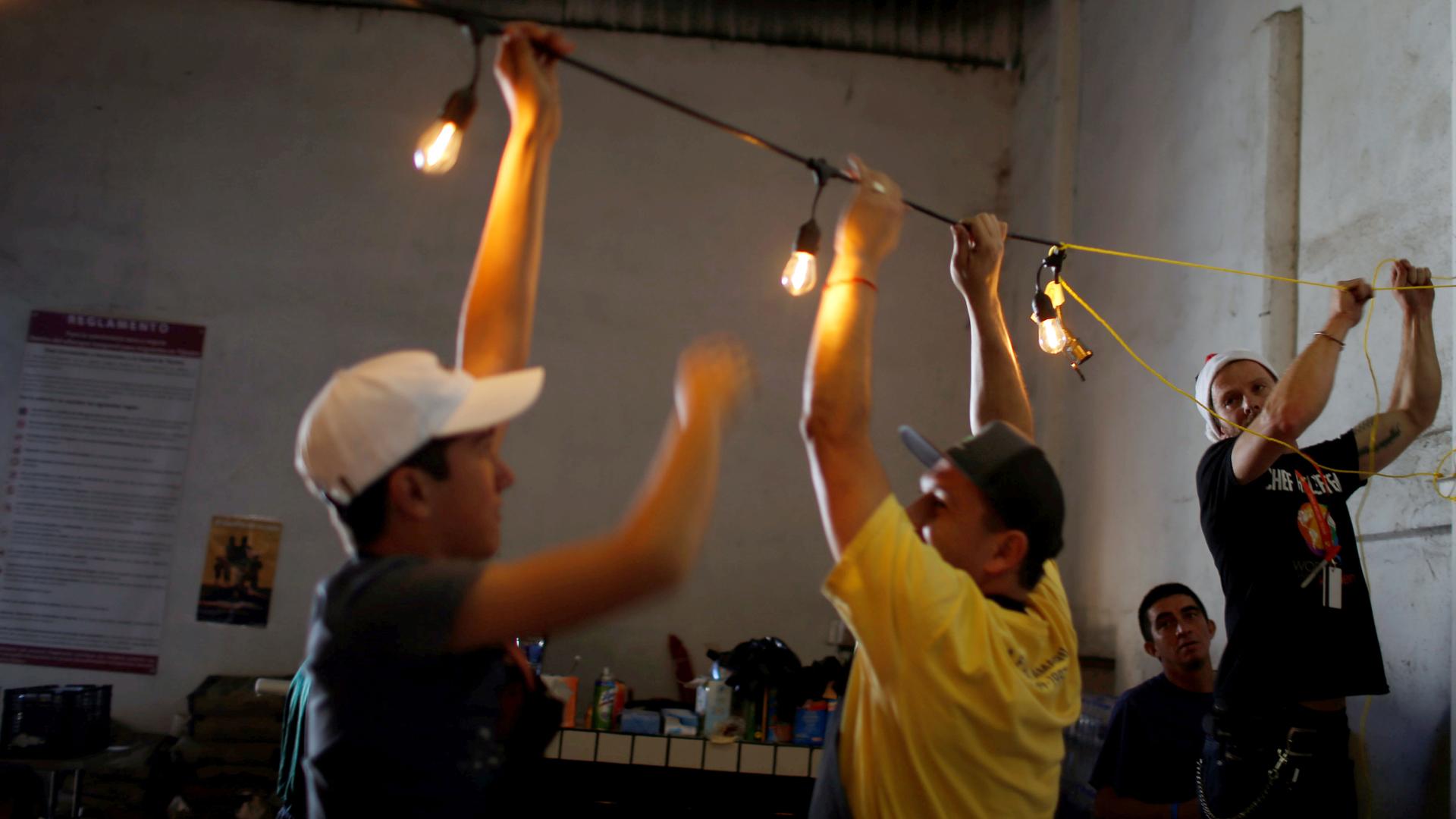 People string lights in a dark room