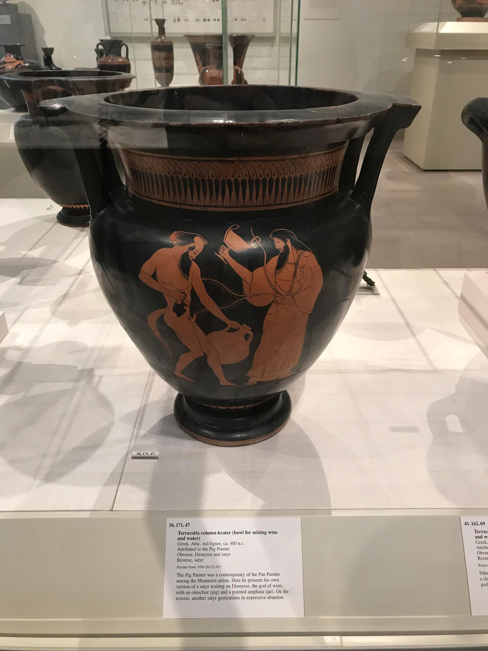 A terracotta mixing bowl from 480 B.C. with a picture of a satyr painted on it.