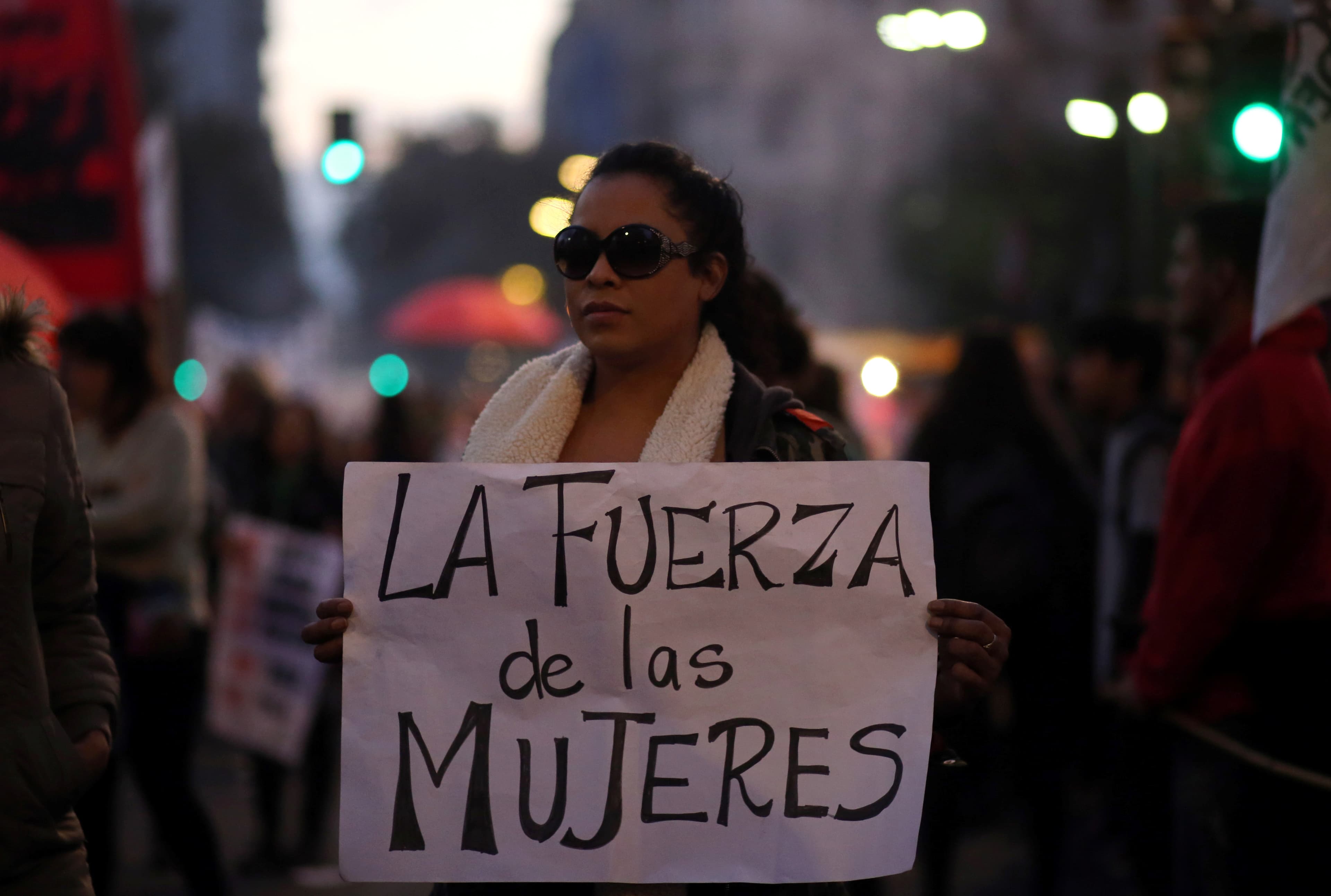 a woman with a sign