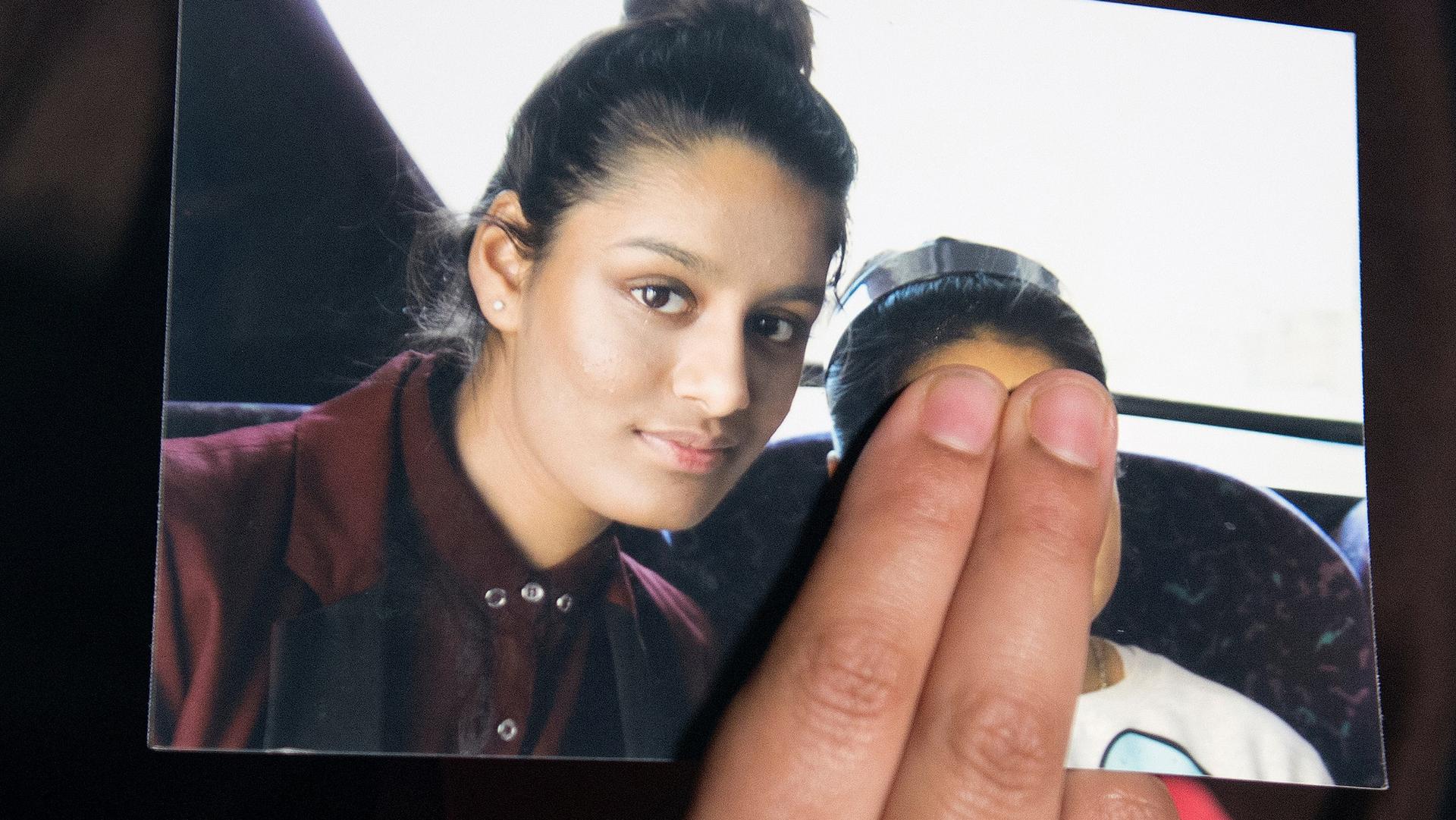 Renu Begum, sister of teenage British girl Shamima Begum who left the UK to join ISIS, holds a photo of her sister as she makes an appeal for Shemima to return home