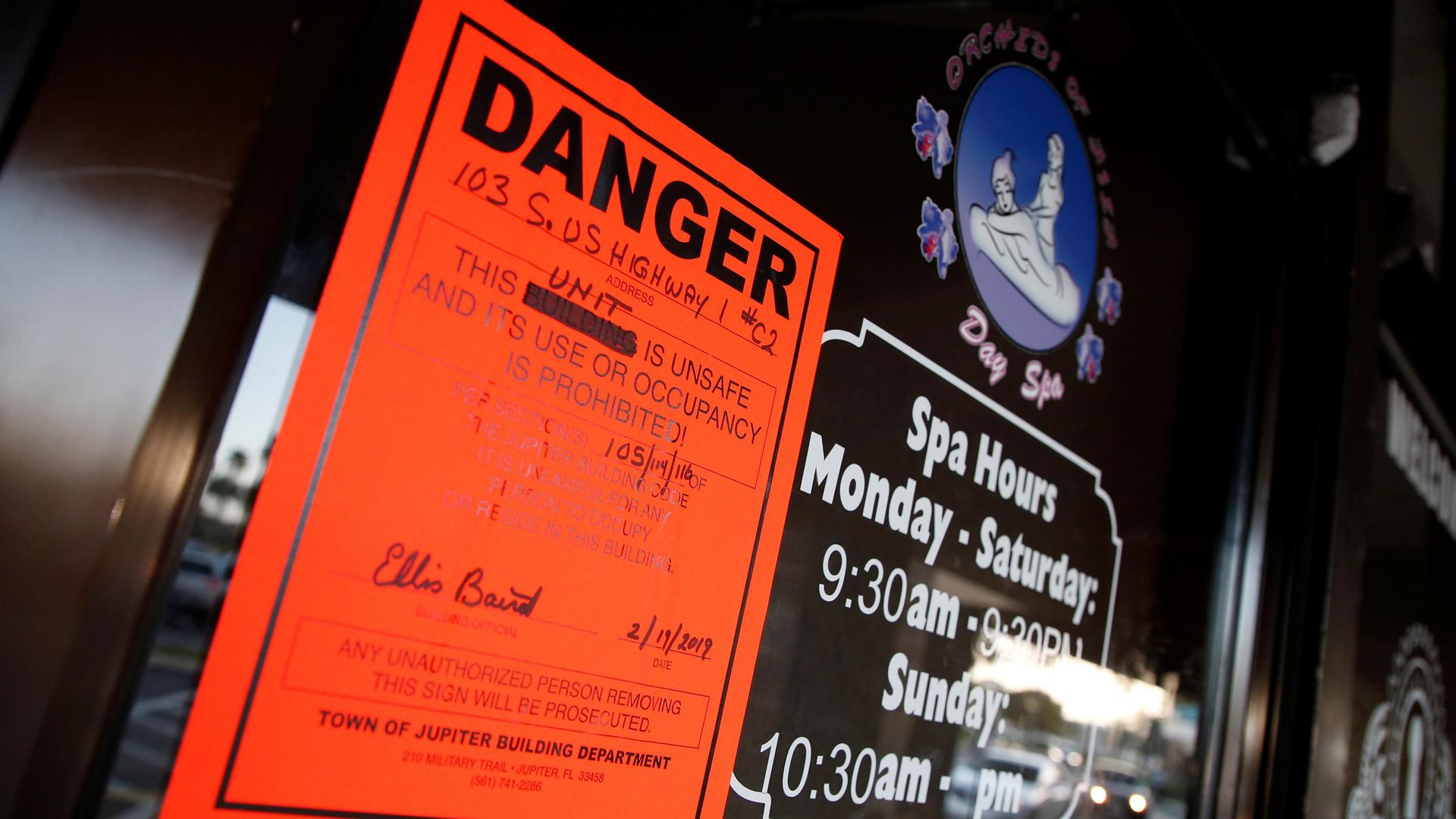 an orange order on the door of the Orchids of Asia Day Spa in Jupiter, Florida, US.