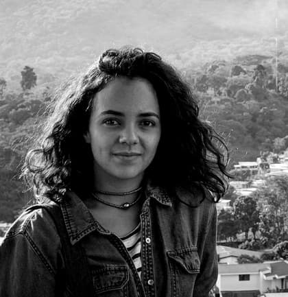 Cristina Baussan is shown in a portrait photograph in black and white.