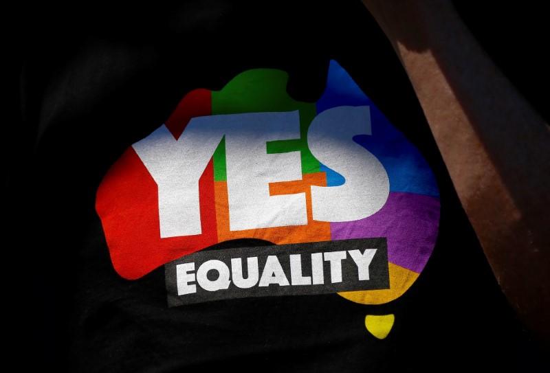 A supporter of the 'Yes' vote for marriage equality wears a shirt as he celebrates