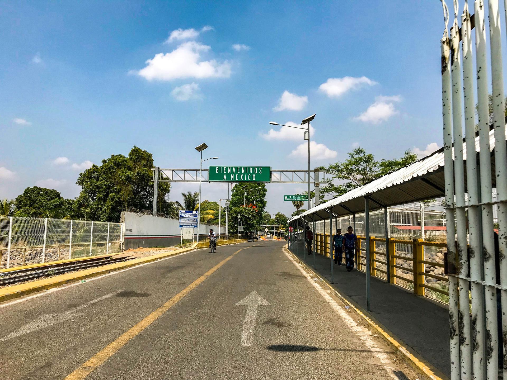 An official entry point from Guatemala into Mexico with a large green sign that reads, 