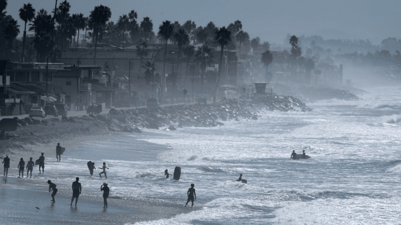 People cool off at the beach during a Southern California heat wave in Oceanside, California, U.S., October 24, 2017.